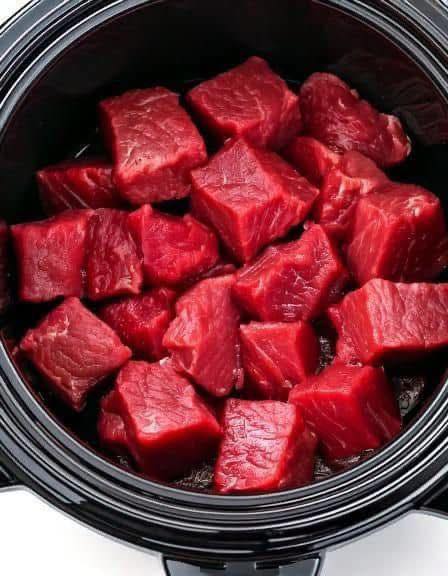 Put raw cubed beef in a slow cooker with these 3 ingredients. You won’t believe how good it tastes.. Full recipe 👇 💬