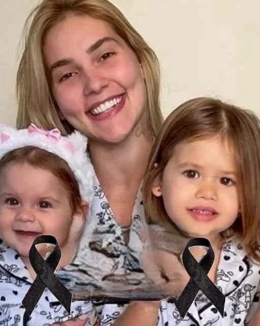 Young woman puts both daughters inside the fir… See more